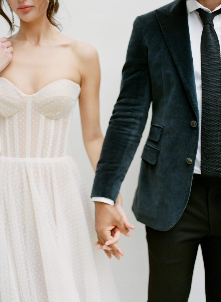 Bride and groom holding hands